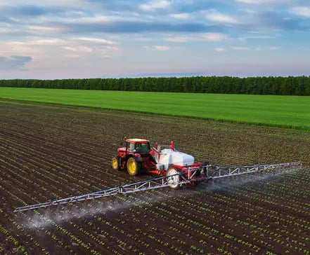 Aerial view of a tractor in a Southern States farm field